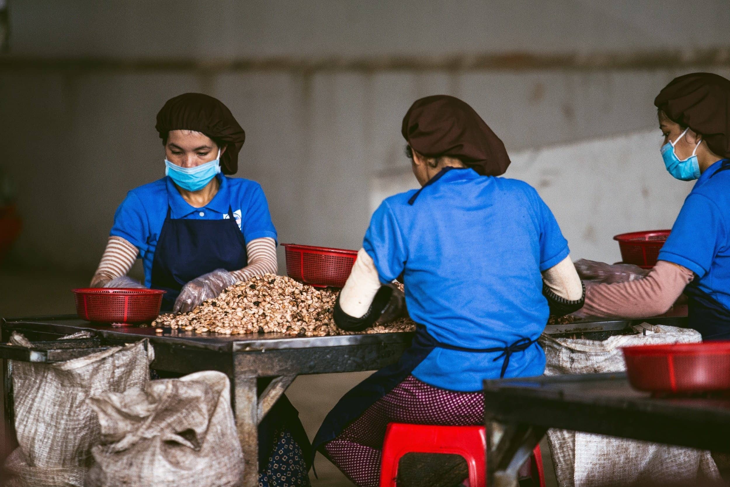 Vietnamese workers sorting through goods