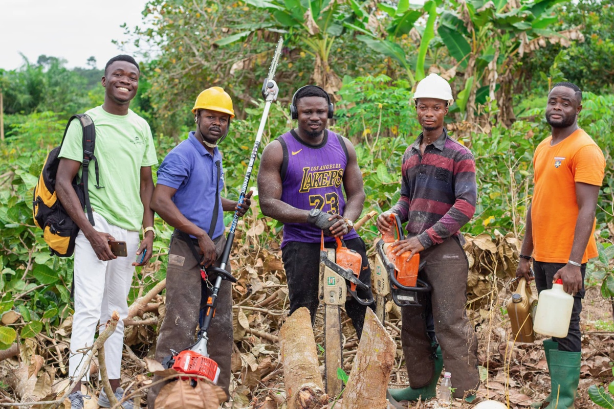 Workers posing for picture after pruning and thinning trees